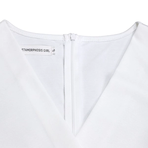 Detail of V-neck collar and invisible zipper on a white elegant stretch dress