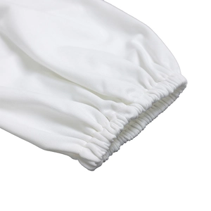 Detailed close-up of white dress elastic cuffs with fine knit texture and neat stitching
