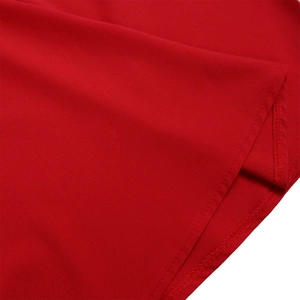 Detail of precise hem stitching and high-quality red fabric texture on a women's dress