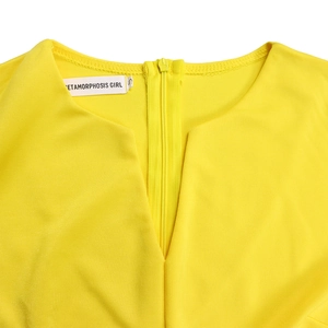 Detail of elegant V-neckline and invisible zipper on the bright yellow pencil dress