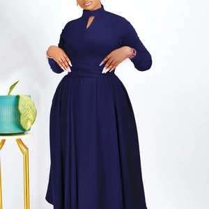 Detail of navy blue long sleeve pleated dress with keyhole neckline and smocked waist