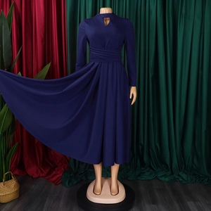 Detail of navy blue dress with pleated high waist and teardrop cutout neckline
