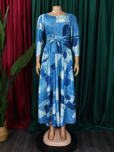 Detail of blue and white printed long dress with waist tie and digital denim pattern