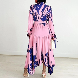 Rear view of floral print midi dress featuring ruffled fishtail hem and waist belt