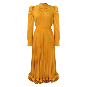 Detail of ginger yellow pleated dress featuring puff sleeves and an elegant waist belt