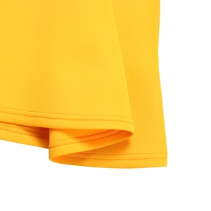 Detail of high-quality double-needle stitching on the hem of a vibrant yellow dress