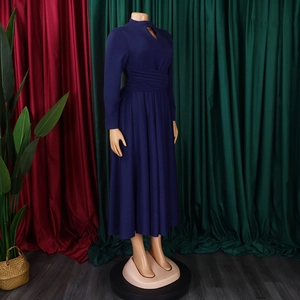 Detail of navy blue maxi dress featuring pleated waist and teardrop cutout neckline