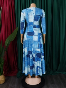 Rear view of long sleeve dress featuring blue denim patchwork print and A-line silhouette