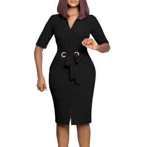 Detail view of the V-neck black dress showing the waist tie and gold eyelet accents