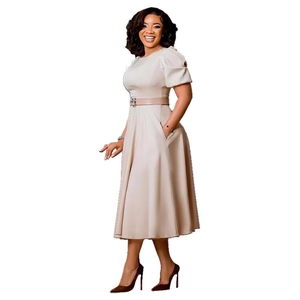 Detail of elegant beige A-line dress with puff sleeves and metal bird buckle belt