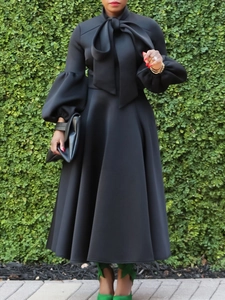 Elegant black maxi dress with lantern sleeves and a bow tie collar for women