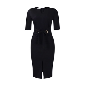 Detail of elegant black V-neck pencil dress with gold buckle waist and front slit
