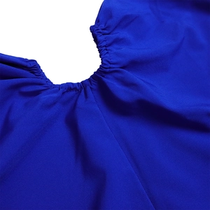 Close-up of royal blue dress featuring elastic pleated texture and high-quality fabric detail