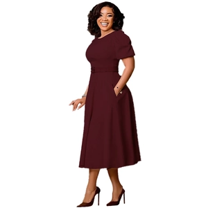 Detail view of a dark red A-line dress with short puff sleeves and a matching waist belt
