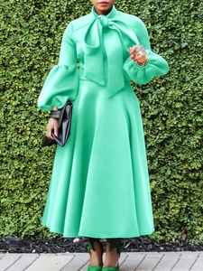 Fashionable mint green lantern sleeve high waist A-line maxi dress with oversized bow tie