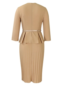 Detail view of the back of a khaki peplum pencil dress with pleats and a slim belt