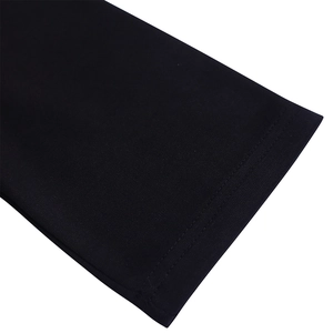 Detail of the high-density knit fabric and double-needle stitching on black dress sleeve