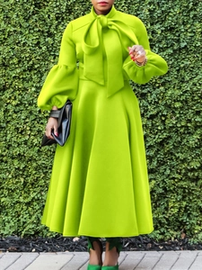 Lime green lantern sleeve A-line dress with elegant bow tie neck and high waist line