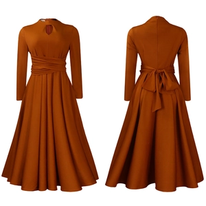 Detail of rust orange A-line dress featuring pleated waist and large back bow tie