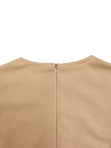 Detail shot of the V-neck dress featuring a hidden back zipper and precise stitching