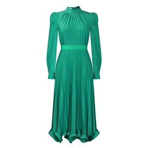 Detail of green puff sleeve top and pleated skirt set with elegant waist belt