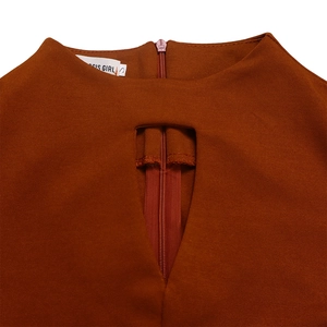 Detail of brick red dress neckline featuring a rectangular cutout and concealed zipper
