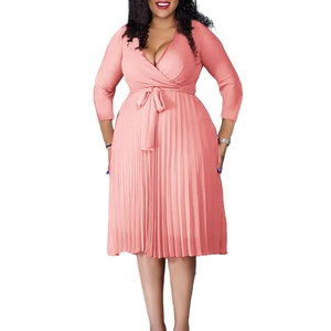 Detail of elegant V-neck pleated wrap dress with adjustable waist tie and 3/4 sleeves