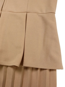 Detail of khaki V-neck pencil dress featuring layered ruffle waist and pleated skirt texture