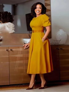 Elegant yellow round neck A-line dress with puff sleeves and buckled waist belt