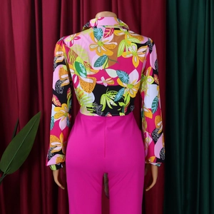 Detail view showing tropical floral print on women long-sleeved shirt with vibrant colors