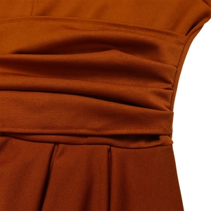 Close-up detail of pleated waist design on dark orange high-stretch knit dress