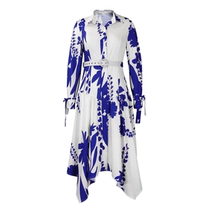 Detail of blue floral print shirt dress with rhinestone buckle belt and asymmetric hemline