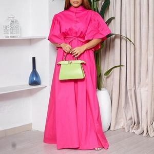 Detail of fuchsia long dress with flare sleeves, button-down front and waist belt