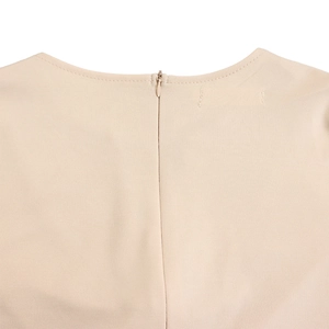 Detail of elegant beige pencil dress showing back invisible zipper and round neckline
