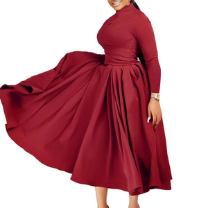 Deep red pleated maxi dress with high collar, long sleeves, and flowy flared hemline