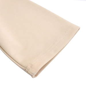 Close-up of skin-tone pencil dress showing high-quality double-needle stitching detail