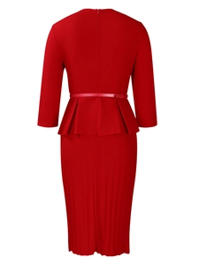 Detail view of red peplum dress with pleated skirt and back zipper closure
