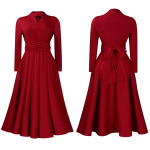 Detail of burgundy maxi dress featuring pleated waist, front cutout, and large back bow