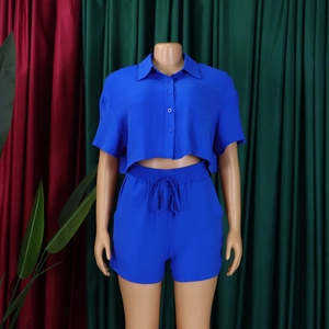 Detail of royal blue short sleeve crop shirt and high-waisted shorts with drawstring set
