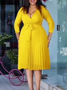 Elegant bright yellow V-neck pleated maxi dress with long sleeves and waist tie belt