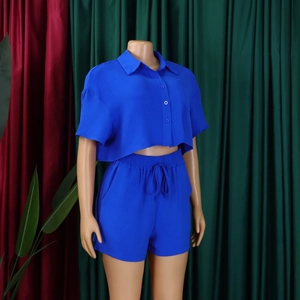Detail of blue lapel short-sleeved crop shirt and drawstring shorts on a mannequin
