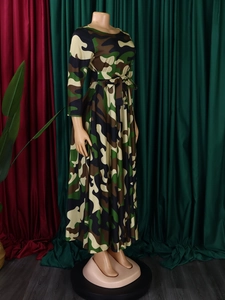 Close-up of camouflage long dress with waist tie and forest print pattern