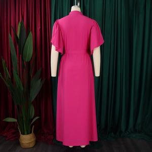 Rear view of fuchsia maxi dress featuring butterfly sleeves and a matching waist belt