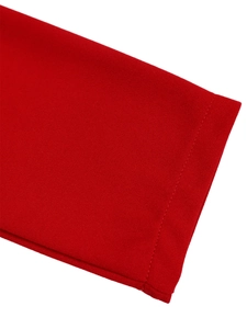 Detailed close-up showing the neat single-needle stitching on the red V-neck dress hem