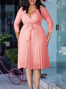 Elegant coral pink V-neck pleated dress with tie-waist and long sleeves for women