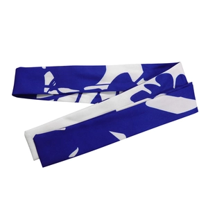 Close-up of blue and white abstract floral print belt on soft polyester fabric
