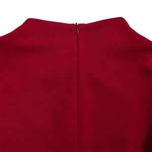 Detail of burgundy dress featuring high-quality invisible back zipper and textured fabric
