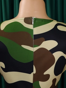 Detail view of the back invisible zipper and camouflage print pattern on a dress