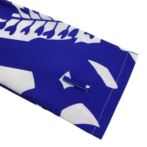 Close-up of blue floral print fabric with a focus on fine stitching and loop detail