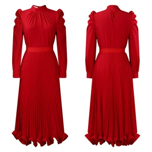 Detailed view of red puff sleeve top and pleated skirt set with elegant high neck design